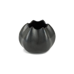 Solid bronze vessel shownin blackened finish; looks like a very smooth barnacle