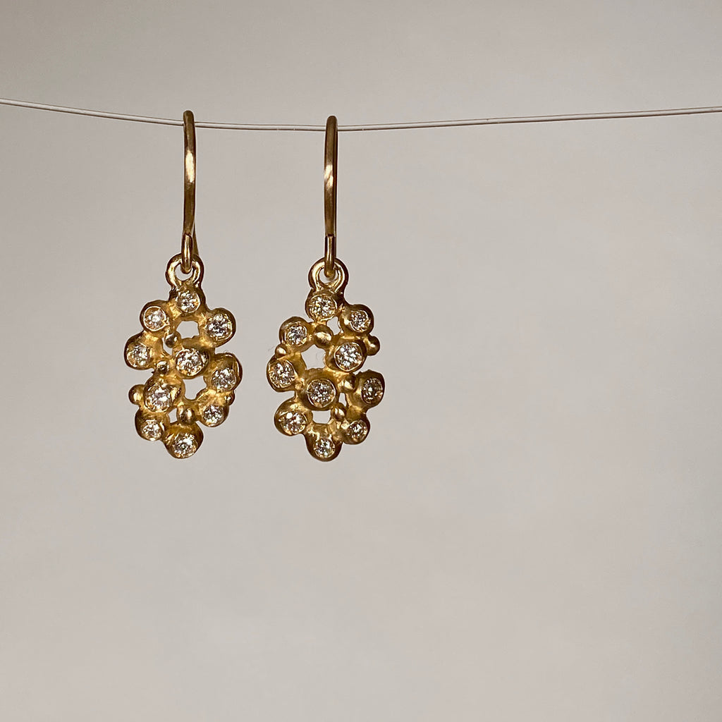 Earrings on wires with clusters of 10 tiny diamond "buds"; shown in yellow gold with a satin finish