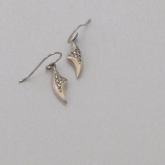 Small claw-like earring on a wire with 7 pavé diamonds; shown in silver