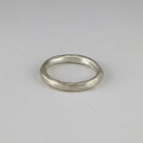 Slim, faceted band that if sliced, would show a round or wide oval cross-section