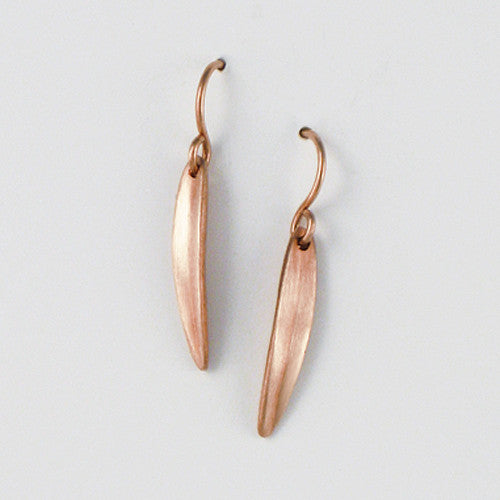 Very small, narrow leaf earring on wire; shape is slightly convex with vertical crease in center; shown in rose gold 