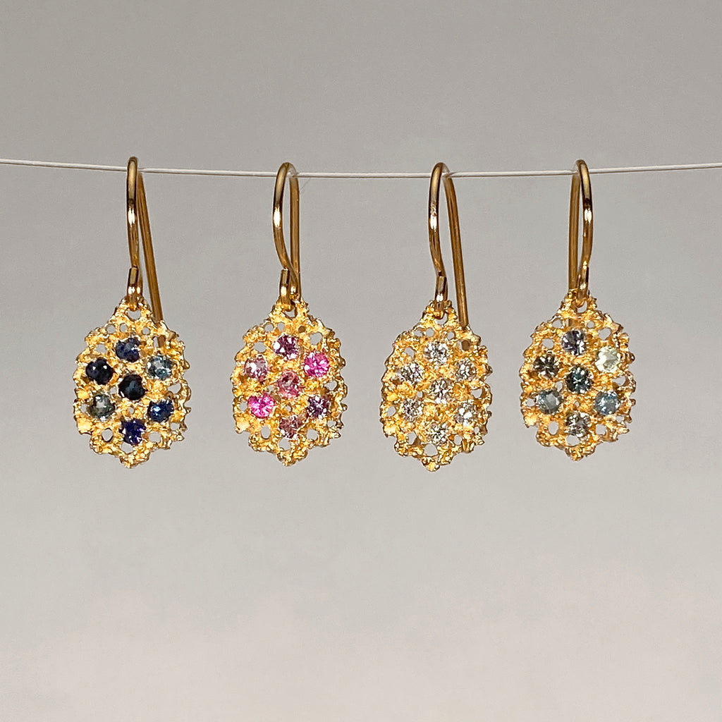 Textured, lacy, lemon-shaped earring, available in yellow gold with a variety of stone options
