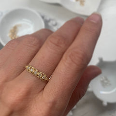 textured, lacy ring on finger, shown in 14k yellow, with diamonds