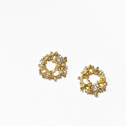 Lacy, textured, tiny stud; each has a white diamond set off-center