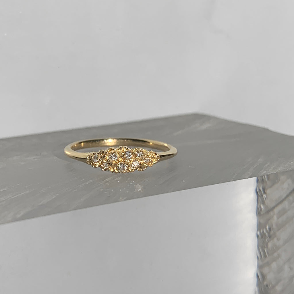 textured, lacy, marquise-shaped component on polished band; shown in 14k yellow with 8 white diamonds
