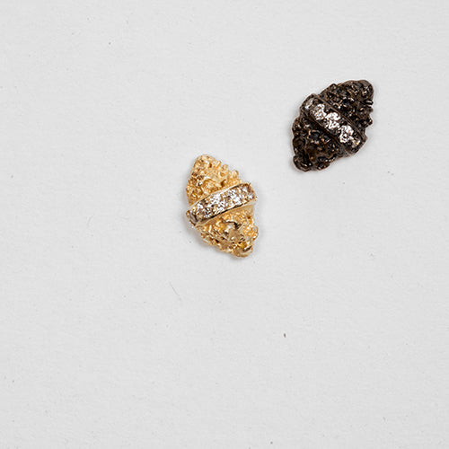 Stud earrings; tiny textured mountains with diamond stripe through the middle; shown in polished gold and blackened silver