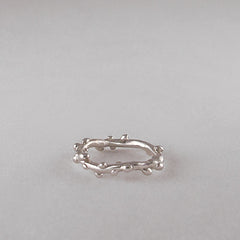 Branch-like ring; organic and asymmetrical; shwon in poihsed silver