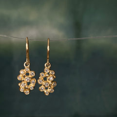 Earrings on wires with clusters of 10 tiny diamond "buds"; shown in yellow gold with a satin finish