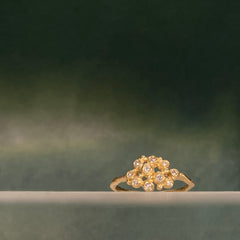 Ring with cluster of 10 tiny diamond "buds"; shown in yellow gold with a satin finish