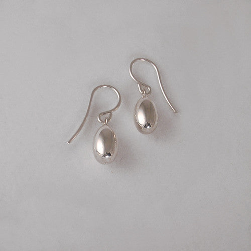 Shiny, solid egg earrings on wires, shown here in silver
