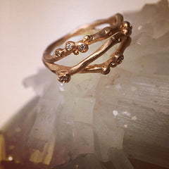 Organic, branch-like ring with three branches. Seven tiny diamond buds per ring. Shown in rose gold.
