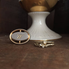 Single branch with 3 diamond buds; shown in yellow gold and shown with pod ring with 1 larger diamond