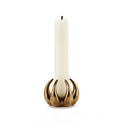 6 sculpted talons curve outward and upward and toward center where they can support taper candle; polished cast bronze; shown holding white candle