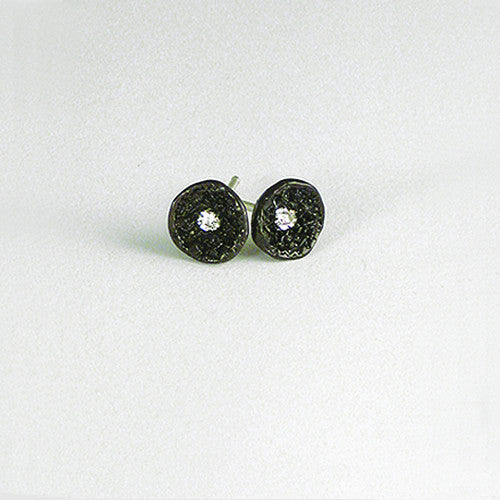 Round, concave, textured stud shown in blackened silver with white diamond center stone