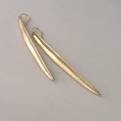 Long, slightly concave, leaf-like shaped earring; shown in 14k yellow