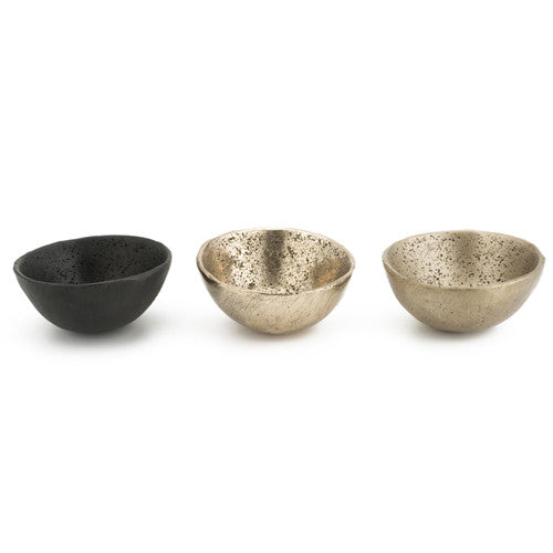 Small, organic bowl with slight texture on outside and more significant rock-like texture inside; shown in satin, polished, and blackened bronze