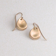 Small, stylized rose petal earring on wire; shown in rose gold