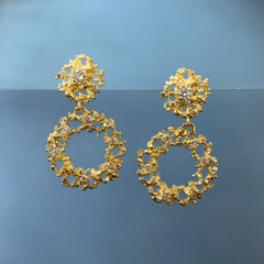 lacy, textured 14k and diamond earrings made of two parts: a small, circular top part and a wreath-like bottom part 