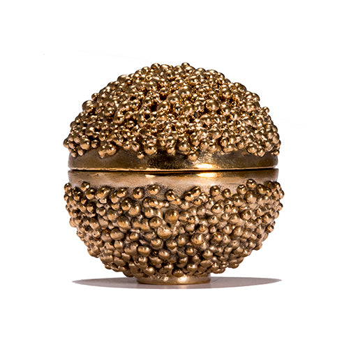 Small spherical footed box; tiny drops cover most of the top and bottom halves; a band of polished metal runs horizontally around the center where the box opens 